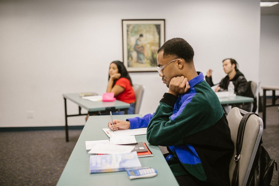 University students focused and studying during an exam.